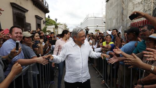 FILE - Mexican President-elect Andres Manuel Lopez Obrador greets supporters as he kicks off a nationwide tour after his election in Mazatlan, Mexico, Sept. 16, 2018. (AP Photo/Eduardo Verdugo, File)