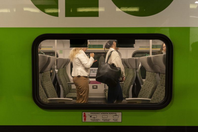 Commuters arrive at Union Station on a GO Train as a national rail shutdown causes delays in Toronto, Thursday, Aug. 22, 2024. (Paige Taylor White /The Canadian Press via AP)