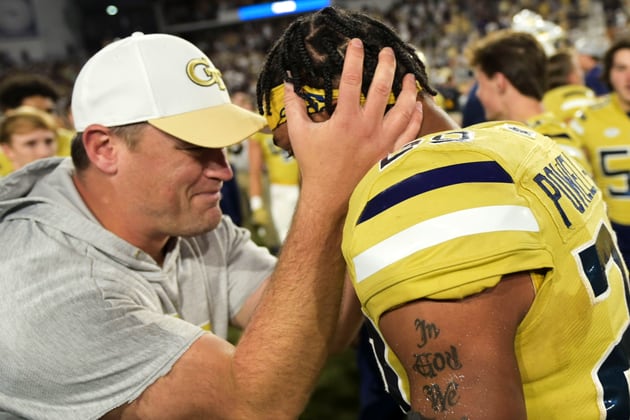 Georgia Tech interim head coach Brent Key celebrates with defensive back Clayton Powell-Lee (29) after defeating Duke 23-20 in overtime of an NCAA college football game, Saturday, Oct. 8, 2022, at Bobby Dodd Stadium, in Atlanta. (Daniel Varnado/Atlanta Journal-Constitution via AP)