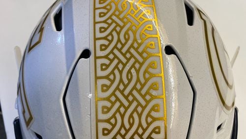 Georgia Tech revealed the helmet decal that it will wear in Saturday's season opener against Florida State in Dublin. The Yellow Jackets will have a white and gold decal down the center of the helmet in the form of a Celtic knot, paying homage to the game's Irish hosts. (AJC photo by Ken Sugiura)