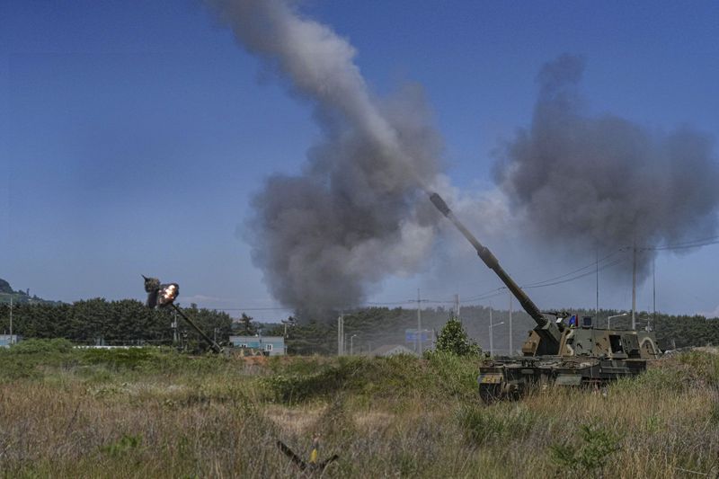 In this photo provided by the South Korea Defense Ministry, the South Korean Marine's K-9 self-propelled howitzers fire during a live-fire drills at Yeonpyeong Island near maritime border with North Korea, South Korea, Wednesday, June 26, 2024. (South Korea Defense Ministry via AP)
