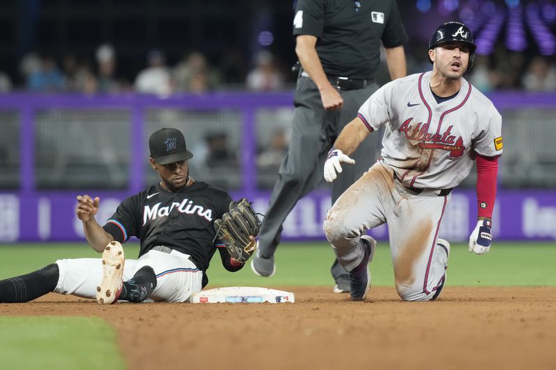 Atlanta Braves' Ramón Laureano reacts after he is tagged out by Miami Marlins second baseman Otto Lopez (61) during the eighth inning of a baseball game, Friday, Sept. 20, 2024, in Miami. (AP Photo/Marta Lavandier)