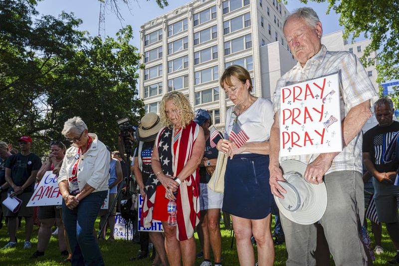 People gather for a prayer vigil on Sunday a few blocks from the site of the Republican National Convention in Milwaukee.