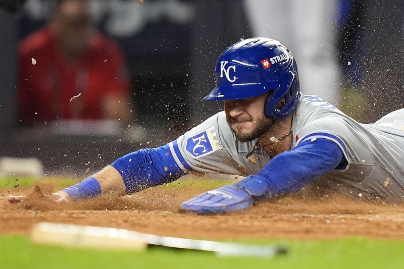 Kansas City Royals Garrett Hampson (2) scores on a hit against the New York Yankees during the fourth inning of Game 2 of the American League baseball playoff series, Monday, Oct. 7, 2024, in New York. (AP Photo/Frank Franklin II)