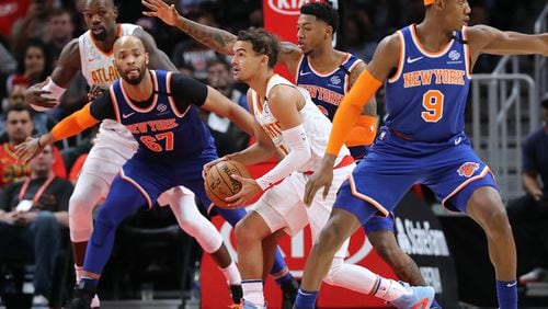 Hawks' Trae Young looks to pass during overtime in a 136-131 loss to the New York Knicks in a NBA basketball game on Wednesday, March 11, 2020, in Atlanta.    Curtis Compton ccompton@ajc.com