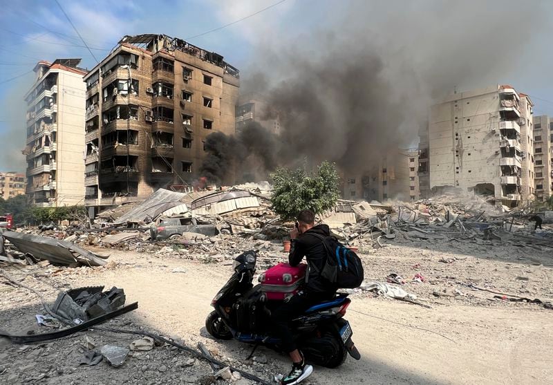 Smoke rises at the site of Israeli airstrikes in Beirut's southern suburbs, Saturday, Sept. 28, 2024. (AP Photo/Hussein Malla)