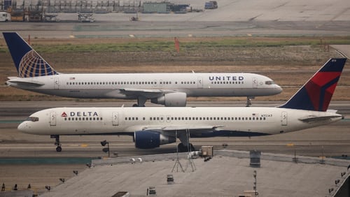 A United Boeing 757 taxis past a Delta Airlines Boeing 757 at Los Angeles International Airport May 29, 2015. (Photo by John Gress/Corbis via Getty Images)