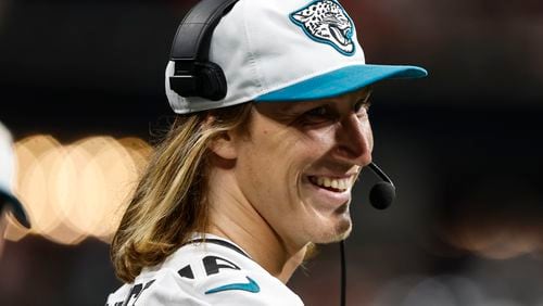 Jacksonville Jaguars quarterback Trevor Lawrence (16) stands on the sidelines in the second half of an NFL preseason footballl game against the Atlanta Falcons, Friday, Aug. 23, 2024, in Atlanta. (AP Photo/Butch Dill)