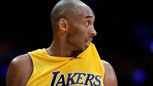 Los Angeles Lakers forward Kobe Bryant watches during the second half of an NBA basketball game against the Houston Rockets in Los Angeles, Thursday, Dec. 17, 2015. (AP Photo/Chris Carlson)