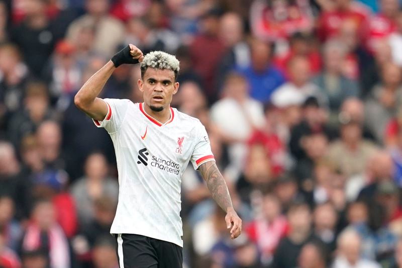 Liverpool's Luis Diaz celebrates after scoring during the English Premier League soccer match between Manchester United and Liverpool at Old Trafford, Sunday, Sept. 1, 2024, in Manchester, England. (AP Photo/Dave Thompson)