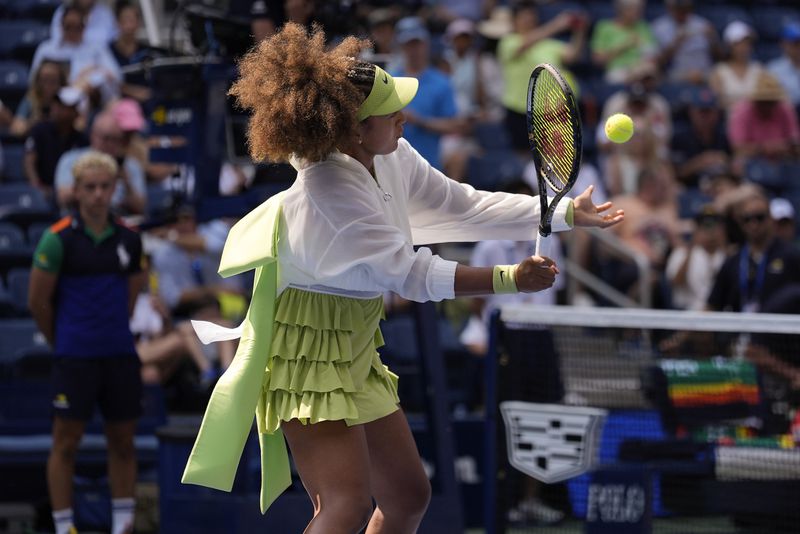 FILE - Naomi Osaka, of Japan, warms up before playing against Jelena Ostapenko, of Latvia, during the first round of the U.S. Open tennis championships, Aug. 27, 2024, in New York. (AP Photo/Seth Wenig, File)