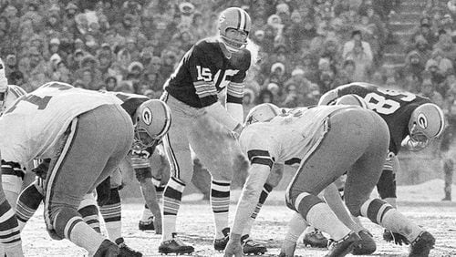 FILE - In this Dec. 31, 1967, file photo, Green Bay Packers quarterback Bart Starr calls signals in bitter cold as he led the Packers to a 21-14 win over the Dallas Cowboys to capture third consecutive National Football League title in Green Bay, Wisc. In the history of NFL games, none stands out for the brutal conditions in which it was played like the NFC championship on the last day of 1967. Simply dubbed the Ice Bowl, those who participated in Cowboys-Packers that day at Lambeau Field still shiver when talking about it. (AP Photo/File)