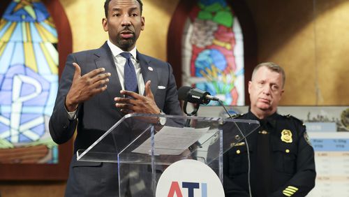 Atlanta Mayor Andre Dickens spoke about the city's crime rate during a news conference in January next to Atlanta police Chief Darin Schierbaum.