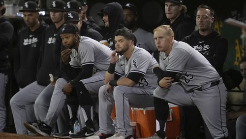 Chicago White Sox players react from the dugout during the eighth inning of a baseball game against the Oakland Athletics in Oakland, Calif., Monday, Aug. 5, 2024. (AP Photo/Jeff Chiu)