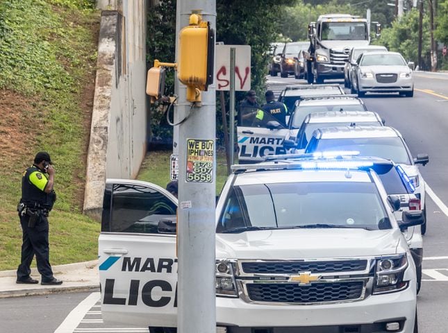 MARTA police and the Fulton County Medical Examiner’s office were on the scene of Rocky Ford Road and the MARTA train tracks investigating a death that shut down a section of track in Atlanta’s Kirkwood neighborhood after a suspected trespasser was hit and killed Thursday morning, June 6, 2024 by a westbound train. (John Spink/AJC)