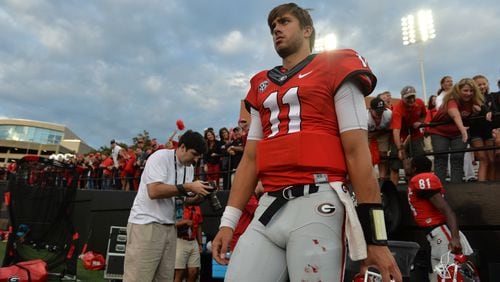 With blood on his pants, Georgia Bulldogs quarterback Greyson Lambert walks off the field following the win over the Vanderbilt Commodores in Nashville Saturday September 12, 2015. BRANT SANDERLIN /BSANDERLIN@AJC.COM