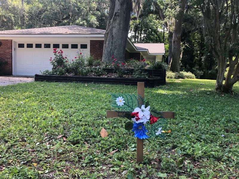 A cross placed in memory of Ahmaud Arbery, who was fatally shot in February. No arrests have been made. Photo: Bert Roughton Jr.