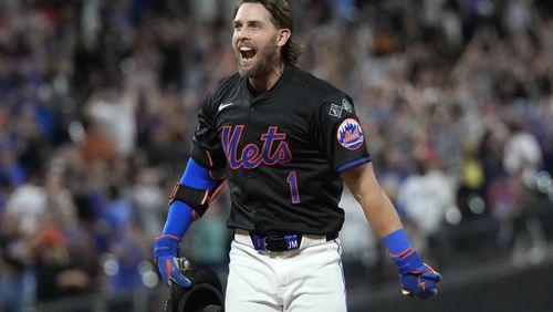 New York Mets' Jeff McNeil reacts after hitting a walkoff single leading Jose Iglesias to score during the 10th inning of a baseball game against the Atlanta Braves, Thursday, July 25, 2024, in New York. (AP Photo/Pamela Smith)