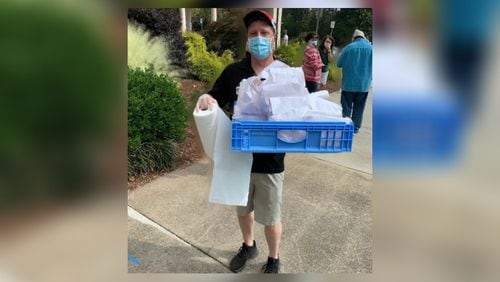 Billy Kramer brought dozens of free burgers to early voters and poll workers during the first week of early voting.