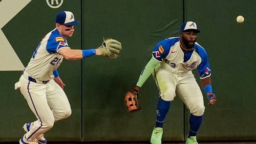 Atlanta Braves outfielders chase a ball hit by Toronto Blue Jays third baseman Ernie Clement in the fourth inning of a baseball game, Saturday, Sept. 7, 2024, in Atlanta. The Braves lost 9-5. (AP Photo/Mike Stewart)