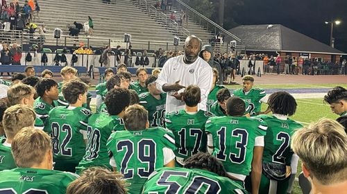 Harrison head coach Luqman Salam speaks to his players after the Hoyas' 31-19 victory over Pebblebrook on Sept. 13, 2024.