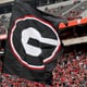 A Georgia flag is run onto the field before the G - Day game at Sanford Stadium Saturday, April 16, 2022, in Athens, Ga. (Jason Getz / Jason.Getz@ajc.com)