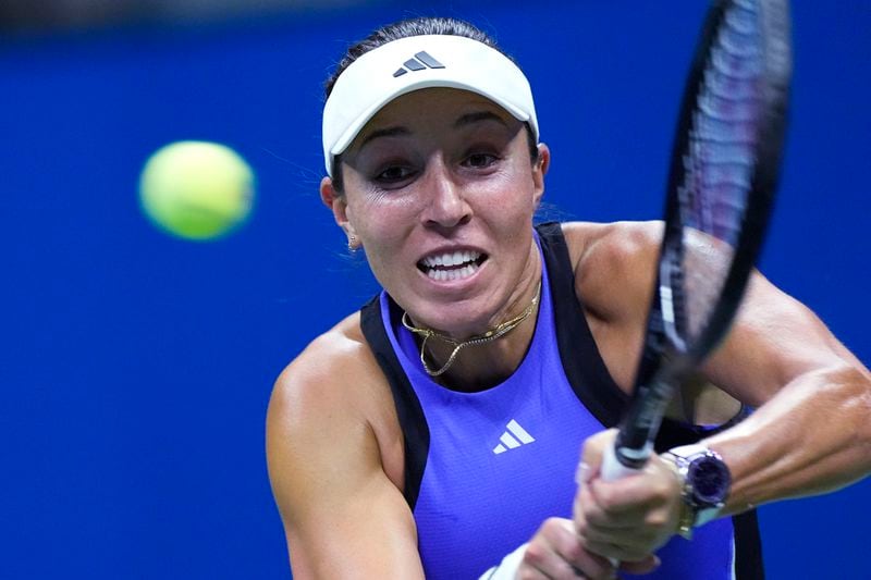 Jessica Pegula, of the United States, returns to Iga Świątek, of Poland, during the quarterfinals of the U.S. Open tennis championships, Wednesday, Sept. 4, 2024, in New York. (AP Photo/Eduardo Munoz Alvarez)