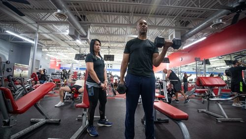 Christopher Ireland, CEO of RideShare, trains with Annabelle Tapponnier at Workout Anytime Gym in Marietta, Ga., on Thursday, Sept. 2, 2021. (Photo/Jenn Finch, The Atlanta Journal-Constitution)