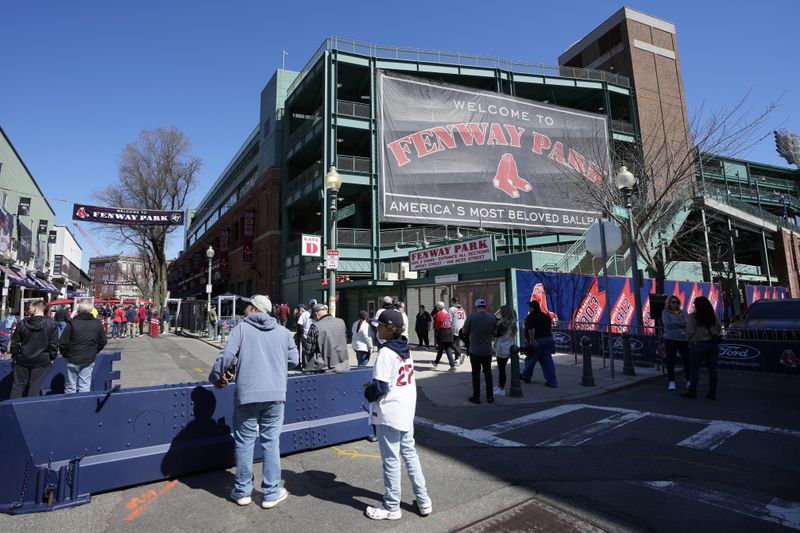 Fans outside Fenway Park before an opening-day baseball game between the Boston Red Sox and the Baltimore Orioles, Tuesday, April 9, 2024, in Boston. (AP Photo/Michael Dwyer)