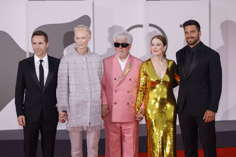 Alessandro Nivola, from left, Tilda Swinton, director Pedro Almodovar, Julianne Moore and Alvise Rigo pose for photographers upon arrival for the premiere of the film 'The Room Next Door' during the 81st edition of the Venice Film Festival in Venice, Italy, on Monday, Sept. 2, 2024. (Photo by Vianney Le Caer/Invision/AP)