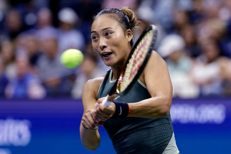 Zheng Qinwen, of China, returns to Aryna Sabalenka, of Belarus, during the quarterfinals of the U.S. Open tennis championships, Tuesday, Sept. 3, 2024, in New York. (AP Photo/Adam Hunger)