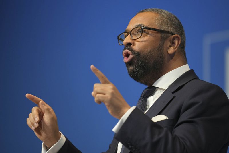 Conservative leadership candidate James Cleverly addresses members during the Conservative Party Conference at the International Convention Centre in Birmingham, England, Wednesday, Oct. 2, 2024.(AP Photo/Kin Cheung)