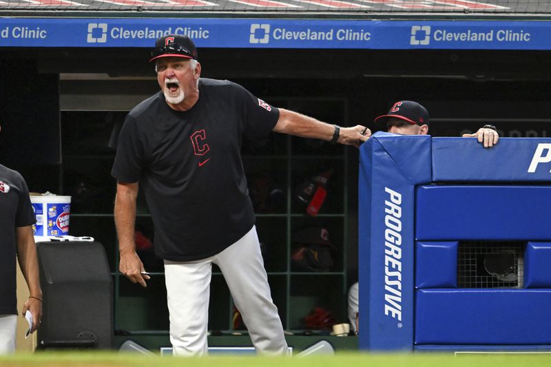 Cleveland Guardians pitching coach Carl Willis argues a strike call during the sixth inning of the second game of a baseball doubleheader against the Kansas City Royals, Monday, August 26, 2024, in Cleveland. (AP Photo/Nick Cammett)