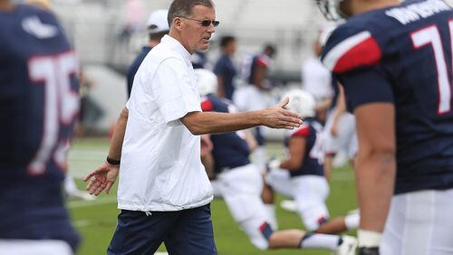 UConn head coach Randy Edsall shakes hands with his players before facing UCF on Saturday, Nov. 11, 2017 at Spectrum Stadium in Orlando, Fla. (Stephen M. Dowell/Orlando Sentinel/TNS)