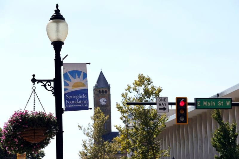 A sign hangs from a street light at the intersection of Main Street and Fountain Avenue in Springfield, Ohio, Wednesday, Sept. 11, 2024. (AP Photo/Paul Vernon)