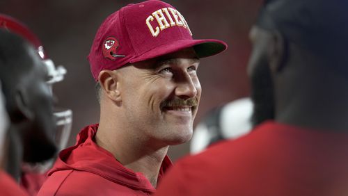 Kansas City Chiefs tight end Travis Kelce smiles on the sidelines during the first half of an NFL preseason football game against the Chicago Bears Thursday, Aug. 22, 2024, in Kansas City, Mo. (AP Photo/Ed Zurga)