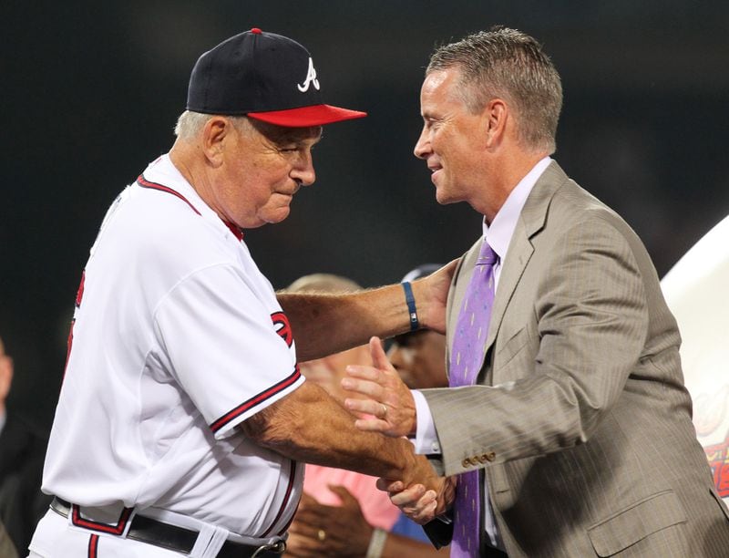 Braves manager Bobby Cox embraces pitcher Tom Glavine on stage during his uniform number retirement in a pre-game ceremony at Turner Field in Atlanta, Friday, August 6, 2010, before the game vs. the San Francisco Giants. Glavine's # 47 is the seventh Braves uniform number to be retired, joining Hank Aaron (44), Eddie Mathews (41), Dale Murphy (3), Phil Niekro (35), Warren Spahn (21), and Greg Maddux (31).    Curtis Compton  ccompton@ajc.com