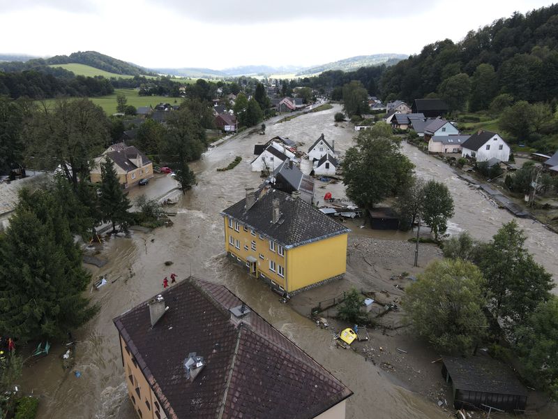 A view of flooded houses in Jesenik, Czech Republic, Sunday, Sept. 15, 2024. (AP Photo/Petr David Josek)