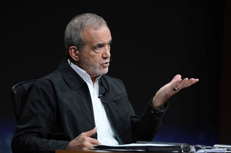 In this photo made available by Iranian state-run TV, IRIB, Iranian presidential candidate reformist Masoud Pezeshkian speaks during a debate with hard-line candidate Saeed Jalili at the TV studio in Tehran, Iran, Tuesday, July 2, 2024. Iran will hold a runoff presidential election Friday, only its second since the 1979 Islamic Revolution, after only 39.9% of its voting public cast a ballot the previous week. (Morteza Fakhri Nezhad/IRIB via AP)