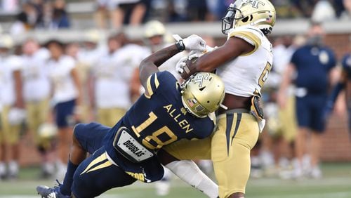 Georgia Tech wide receiver Avery Boyd (right) makes a catch under pressure during the 2021 spring game. (Hyosub Shin / Hyosub.Shin@ajc.com)