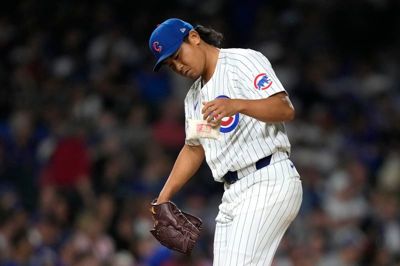 Chicago Cubs pitcher Shota Imanaga goes to the rosin bag during the fifth inning of a baseball game against the Pittsburgh Pirates on Wednesday, Sept. 4, 2024, in Chicago. (AP Photo/Charles Rex Arbogast)