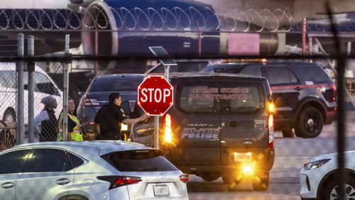 Multiple Atlanta Fire Rescue Department units and police park outside a Delta Maintenance facility near Hartsfield-Jackson International Airport early Tuesday, Aug. 27, 2024 in Atlanta. (John Spink/Atlanta Journal-Constitution via AP)