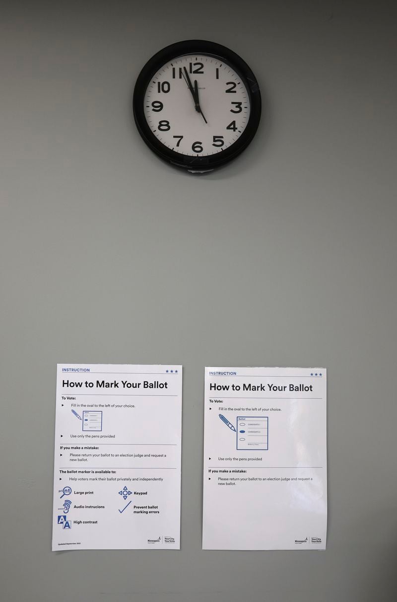 Instructions are posted on the wall inside the City of Minneapolis early voting center, Thursday, Sept. 19, 2024, in St. Paul, Minn. In-person voting in the 2024 presidential contest begins Friday in three states, including Democratic vice presidential candidate Tim Walz's home state of Minnesota, with just over six weeks left before Election Day. (AP Photo/Adam Bettcher)