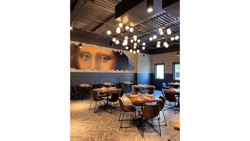 The interior of Grana in Dunwoody features a mural of Mona Lisa's eyes. / Courtesy of Grana