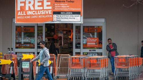 Patrons gather outside of The Home Depot to gather supplies in Dunwoody. The Home Depot has been letting a limited number of people into their store during the spread of COVID-19. (Photo/Rebecca Wright for the AJC)