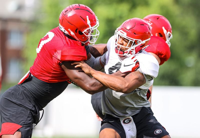 Georgia players such as tight end Darnell Washington (L) and outside linebacker Nolan Smith (4) are excited to finally get to lock up against another team when they play Arkansas in Fayetteville this coming Saturday. (Tony Walsh/UGA)