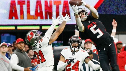 Atlanta Falcons wide receiver Drake London (5) goes up for an impressive reception during the fourth quarter against the Tampa Bay Buccaneers on Sunday, Dec. 10, 2023,  at Mercedes-Benz Stadium in Atlanta. 
Miguel Martinez/miguel.martinezjimenez@ajc.com