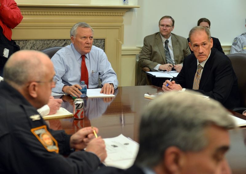 Then-Gov. Nathan Deal, left, and Georgia Emergency Management Director Charley English participate in an Emergency Operations Command Committee meeting in February 2014, icy gridlock turned metro Atlanta into a laughingstock. The fallout from that storm ushered in vast changes to Georgia’s emergency management protocol. BRANT SANDERLIN /BSANDERLIN@AJC.COM