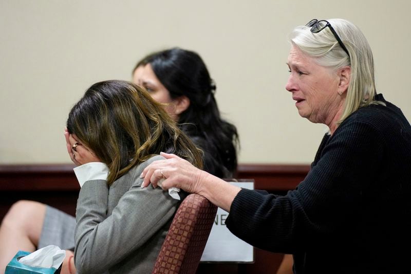 Hilaria Baldwin, left, wife of actor Alec Baldwin, and his sister Elizabeth Keuchler react during Alec Baldwin's trial for involuntary manslaughter for the 2021 fatal shooting of cinematographer Halyna Hutchins during filming of the Western movie "Rust," Friday, July 12, 2024, at Santa Fe County District Court in Santa Fe, N.M. The judge threw out the case against Alec Baldwin in the middle of his trial and said it cannot be filed again. (Ramsay de Give/Pool Photo via AP)