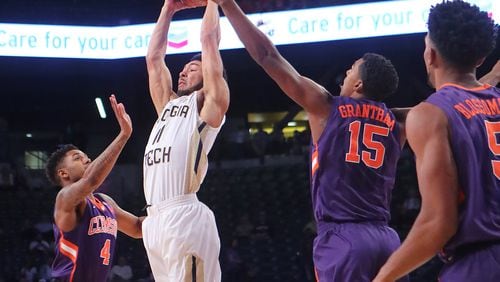 January 12, 2017, Atlanta: Georgia Tech guard Josh Heath goes up for a pass over Clemson defenders Shelton Mitchell (left) and Donte Grantham during an NCAA basketball game on Thursday, Jan. 12, 2017, in Atlanta. Curtis Compton/ccompton@ajc.com